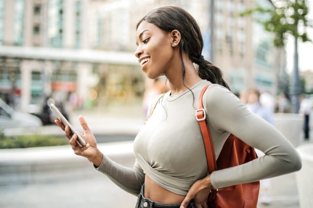 shallow-focus-photo-of-woman-holding-smartphone-3807547